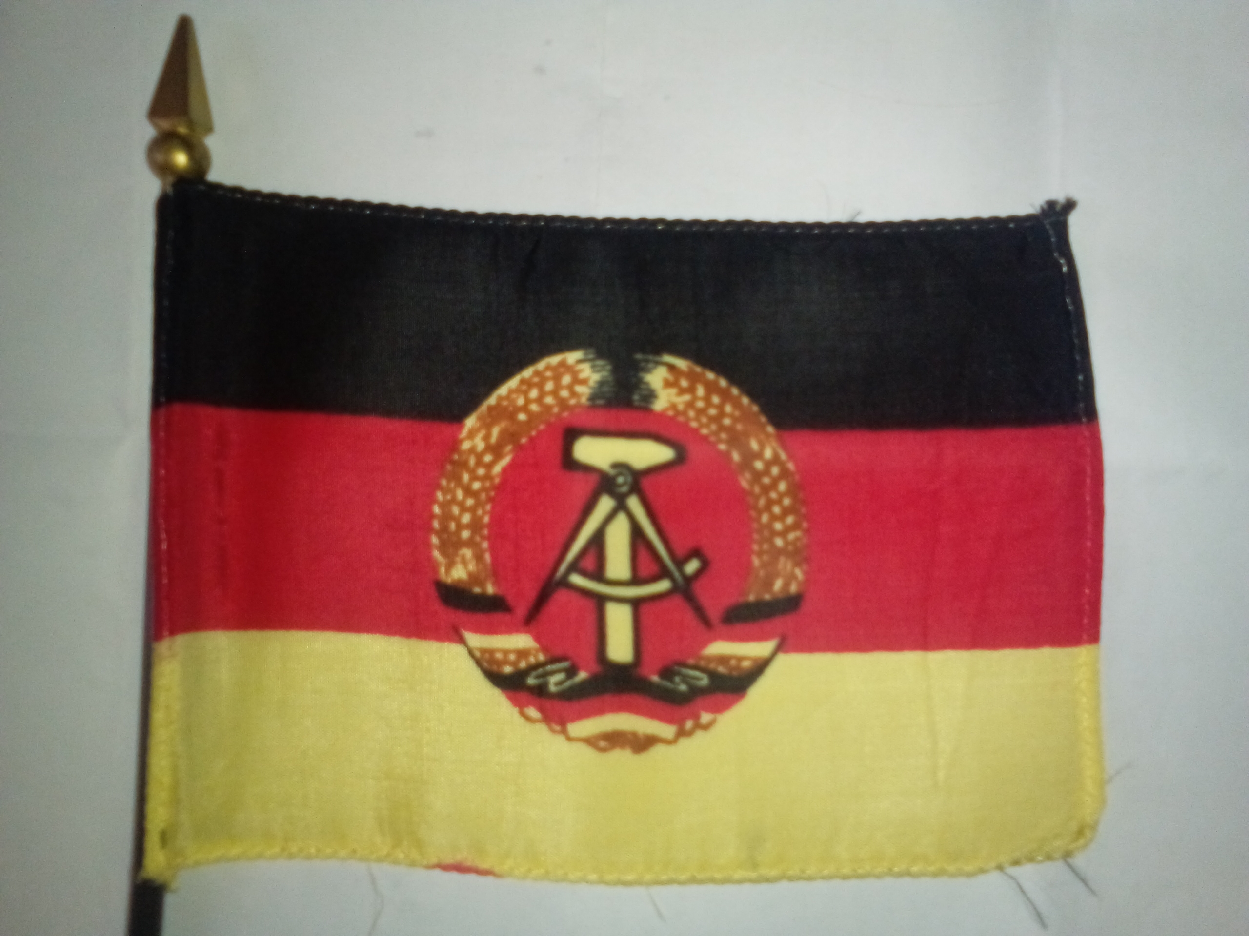 Vintage miniature desk flag of East Germany, 1959-1990.