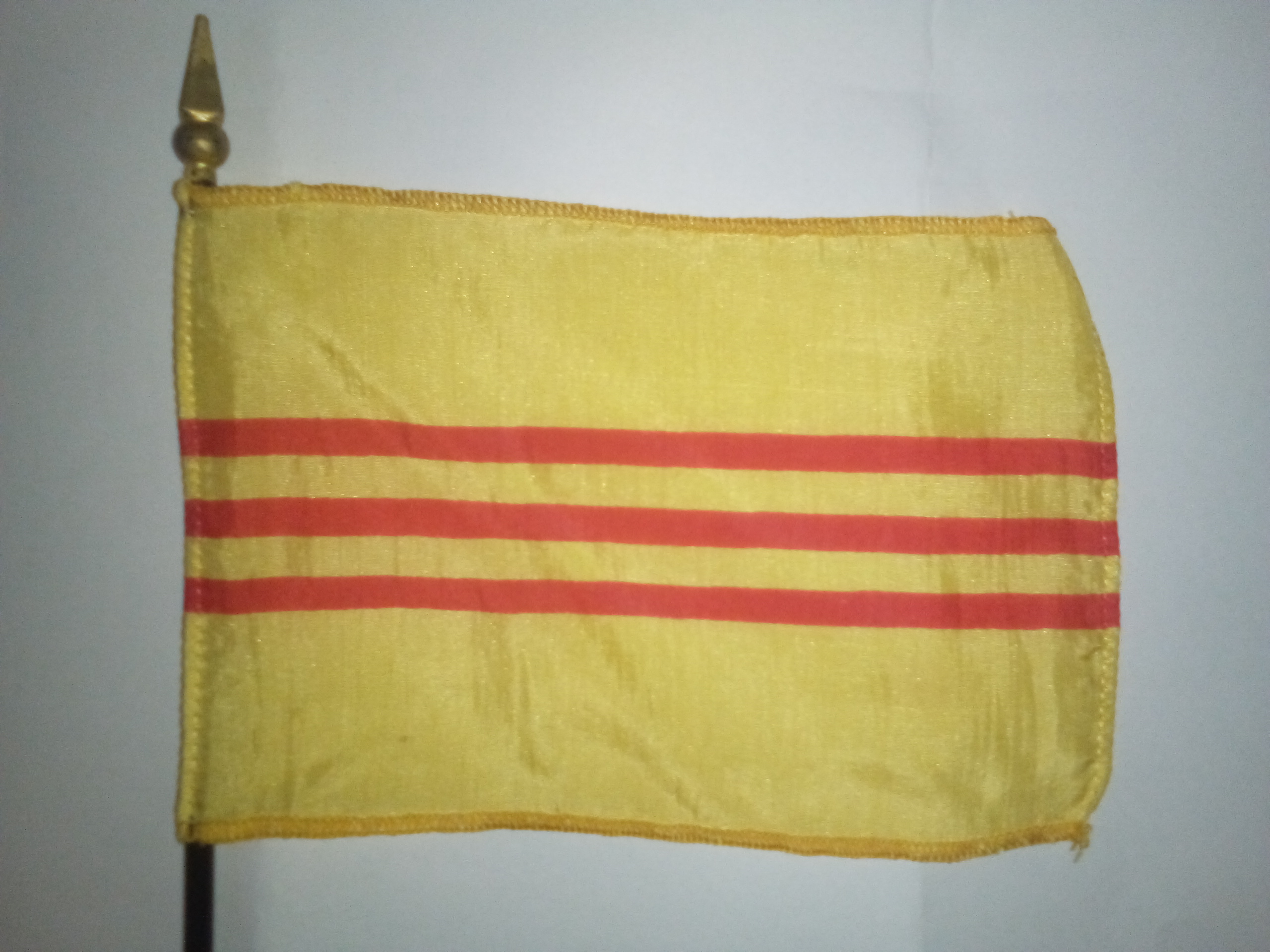 Vintage miniature flag of South Vietnam, in use from 1948 until 1975.